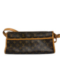 A Louis Vuitton monogram canvas shoulder bag in dark brown with tan leather trim and strap, shown against a neutral light gray background.