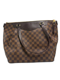 Front view of a Louis Vuitton Westminster GM tote bag in Damier Ébène canvas with dark brown leather shoulder straps and top zip closure.