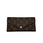 Authentic Louis Vuitton Zippy Wallet in brown Damier Ebene coated canvas with a gold-tone wrap-around zipper