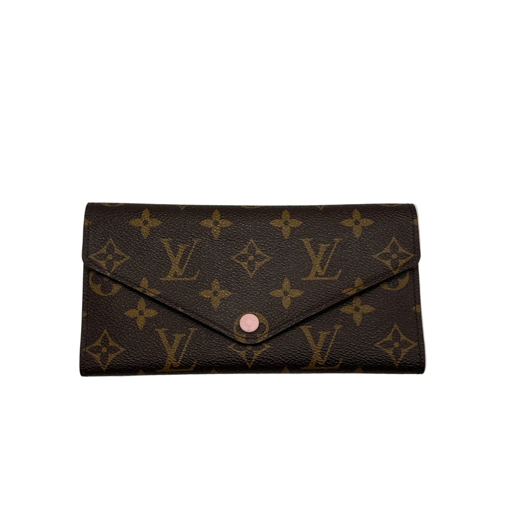 Authentic Louis Vuitton Zippy Wallet in brown Damier Ebene coated canvas with a gold-tone wrap-around zipper