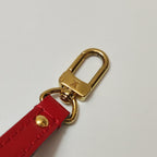 the hook of authentic louis Vuitton preloved alma bb bag in gold hardware with lv logo engraving