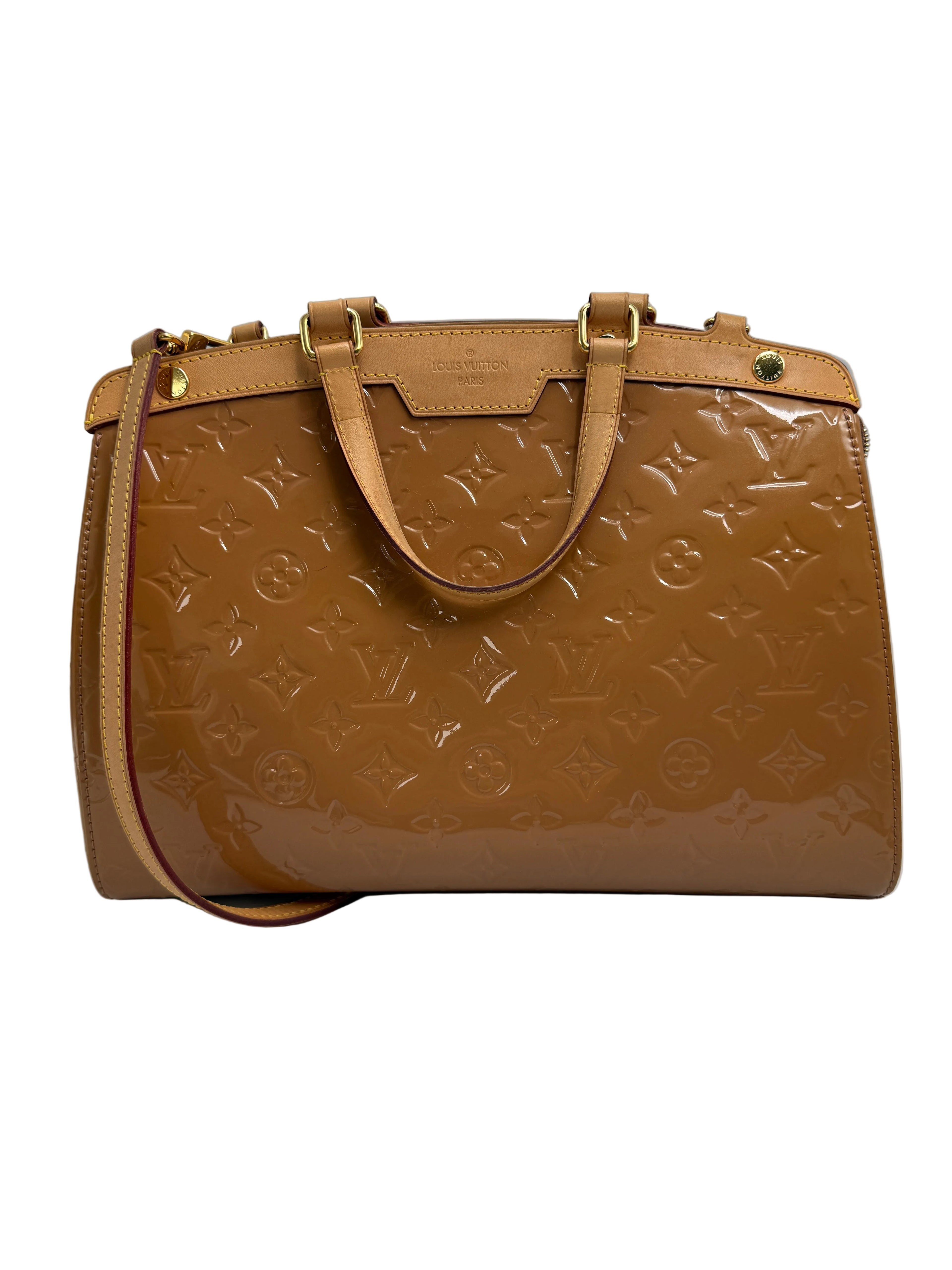 A Louis Vuitton monogram coated canvas handbag in tan brown, featuring tan leather top handles, gold-tone hardware, and a matching shoulder strap, photographed on a neutral gray background.