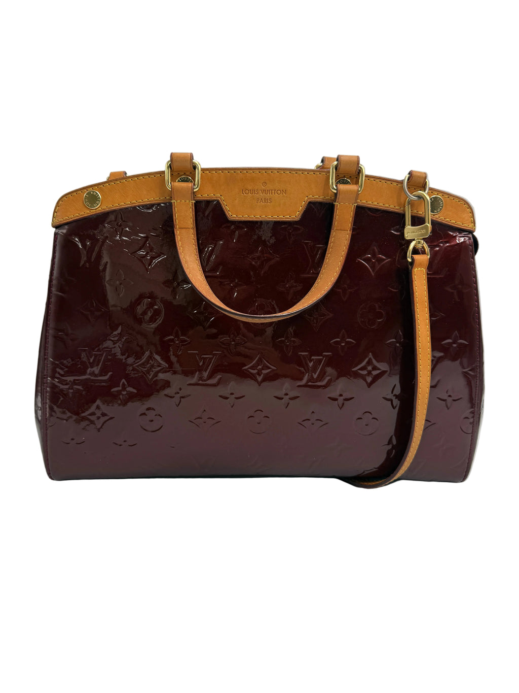 A Louis Vuitton Speedy handbag in glossy burgundy monogram coated canvas with tan leather trim and handles, shown against a neutral light gray background.