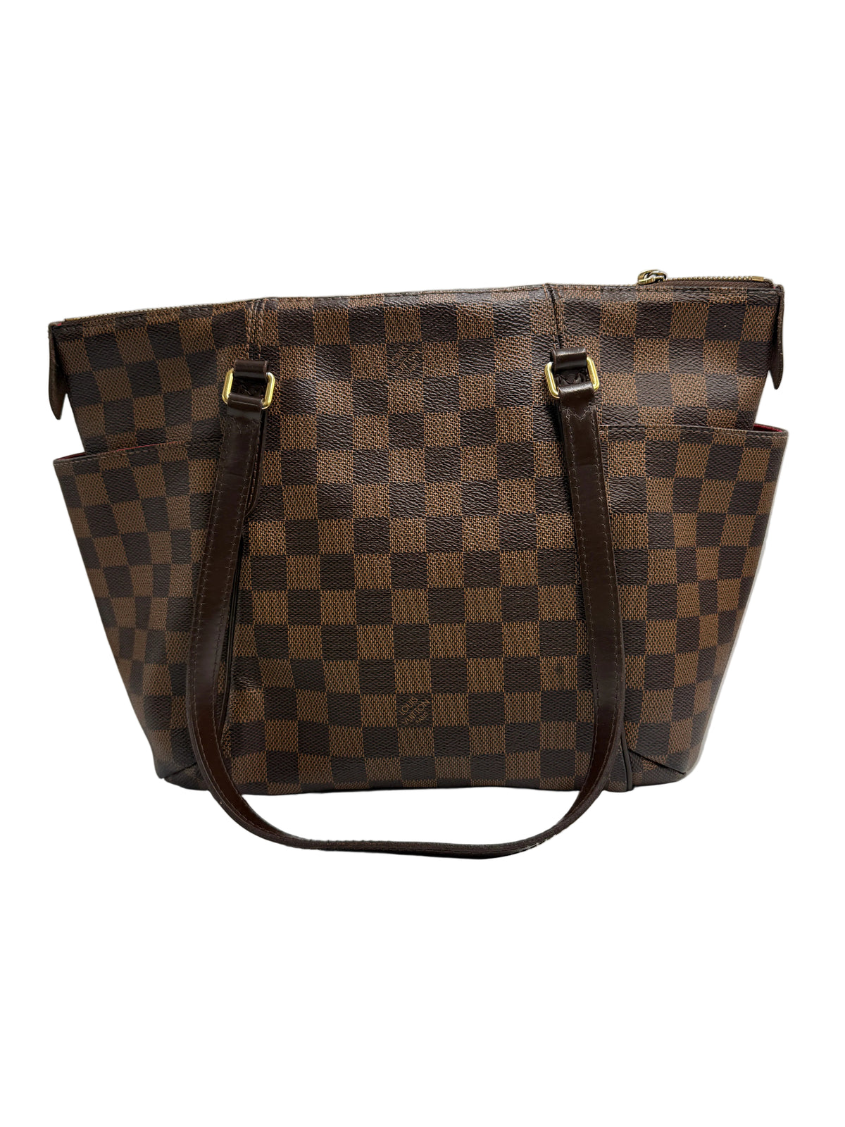 A brown checkerboard canvas tote bag with dark brown leather handles and gold-tone hardware, photographed against a neutral light gray background.