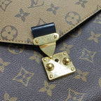 preowned louis vuitton metis pochette reverse monogram canvas the view of the gold hardware buckle no scratches no tarnishing