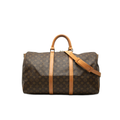 Louis Vuitton monogram canvas duffel bag with tan leather handles and shoulder strap, shown against a plain white background.