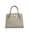 Front view of a Prada Saffiano Cuir Small Double bag in off-white leather with silver Prada Milano logo.