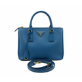 front view of authentic preloved prada blue saffiano leather crossbody bag with gold hardware and strap