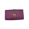 Front view of a fuchsia purple Saint Laurent Ligne Y clutch featuring the gold-tone Y-shaped clasp
