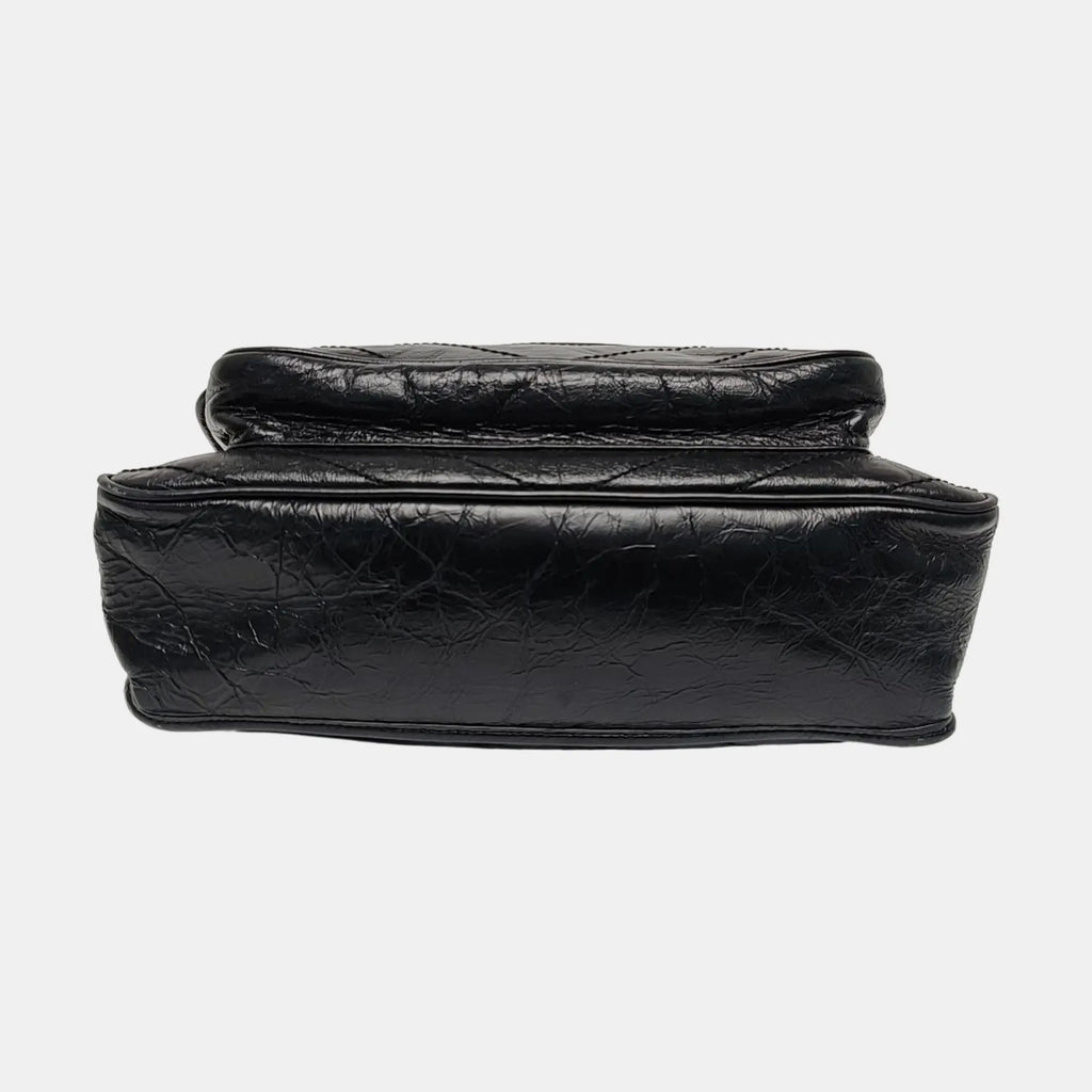 the bottom view of saint laurent NiKi Medium bag in soft black leather 
