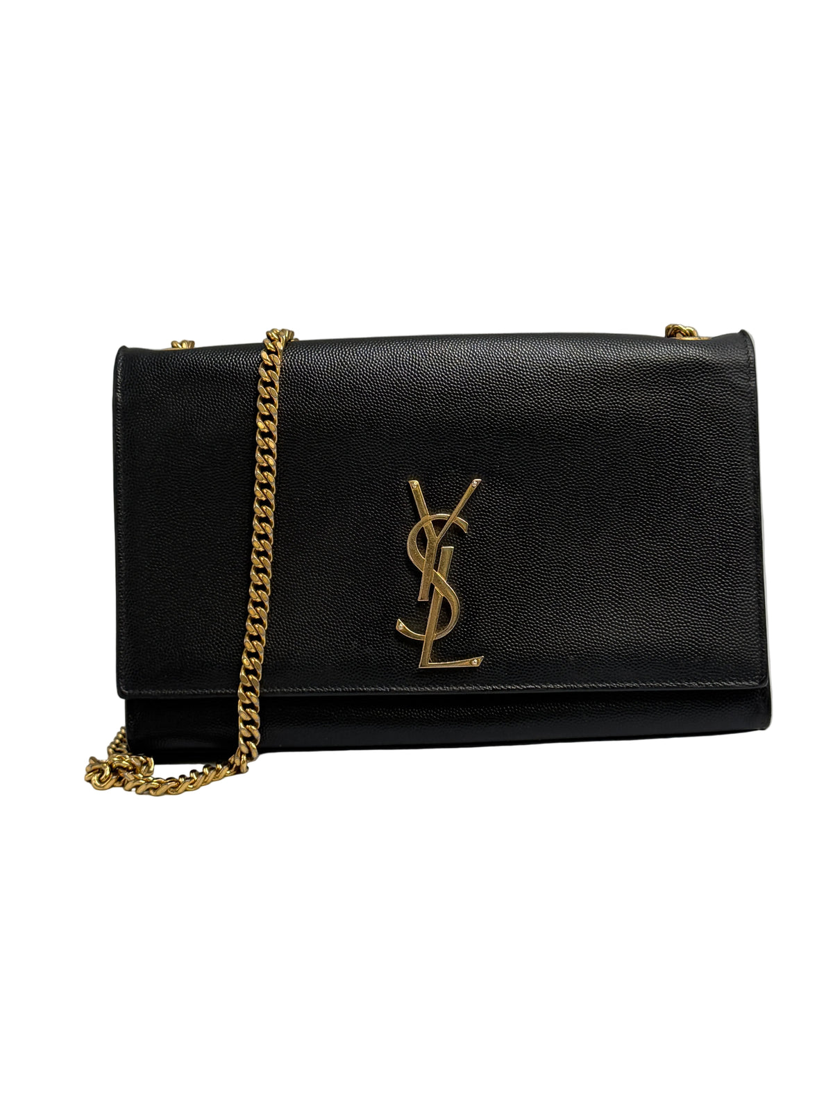 A black pebbled leather Saint Laurent shoulder bag with a gold-tone YSL logo on the front flap and a gold chain strap, photographed against a neutral light gray background.